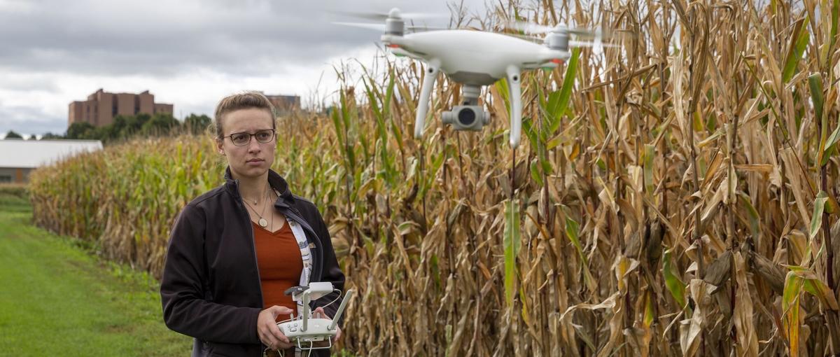 Ph.D. student Dorothy Kirsch using a drone to study corn